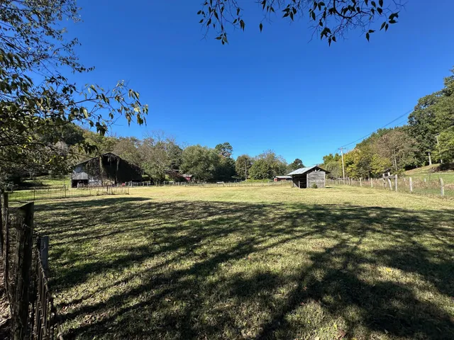 a backyard of a house with lots of green space