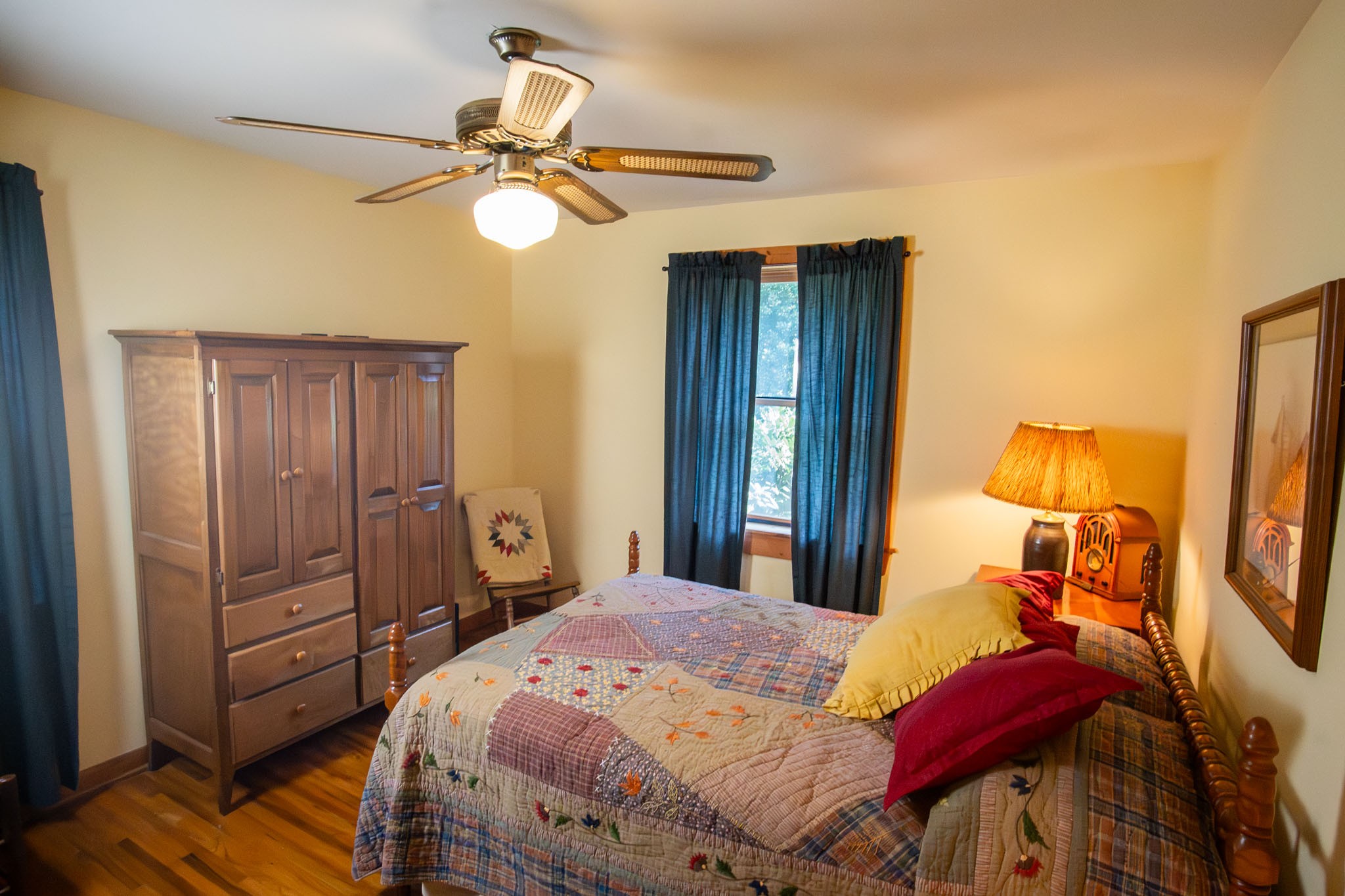 6861 Arno-Allisona Road College Grove, TN 37046 - Photo 31 of 68 a bedroom with a bed and a chandelier