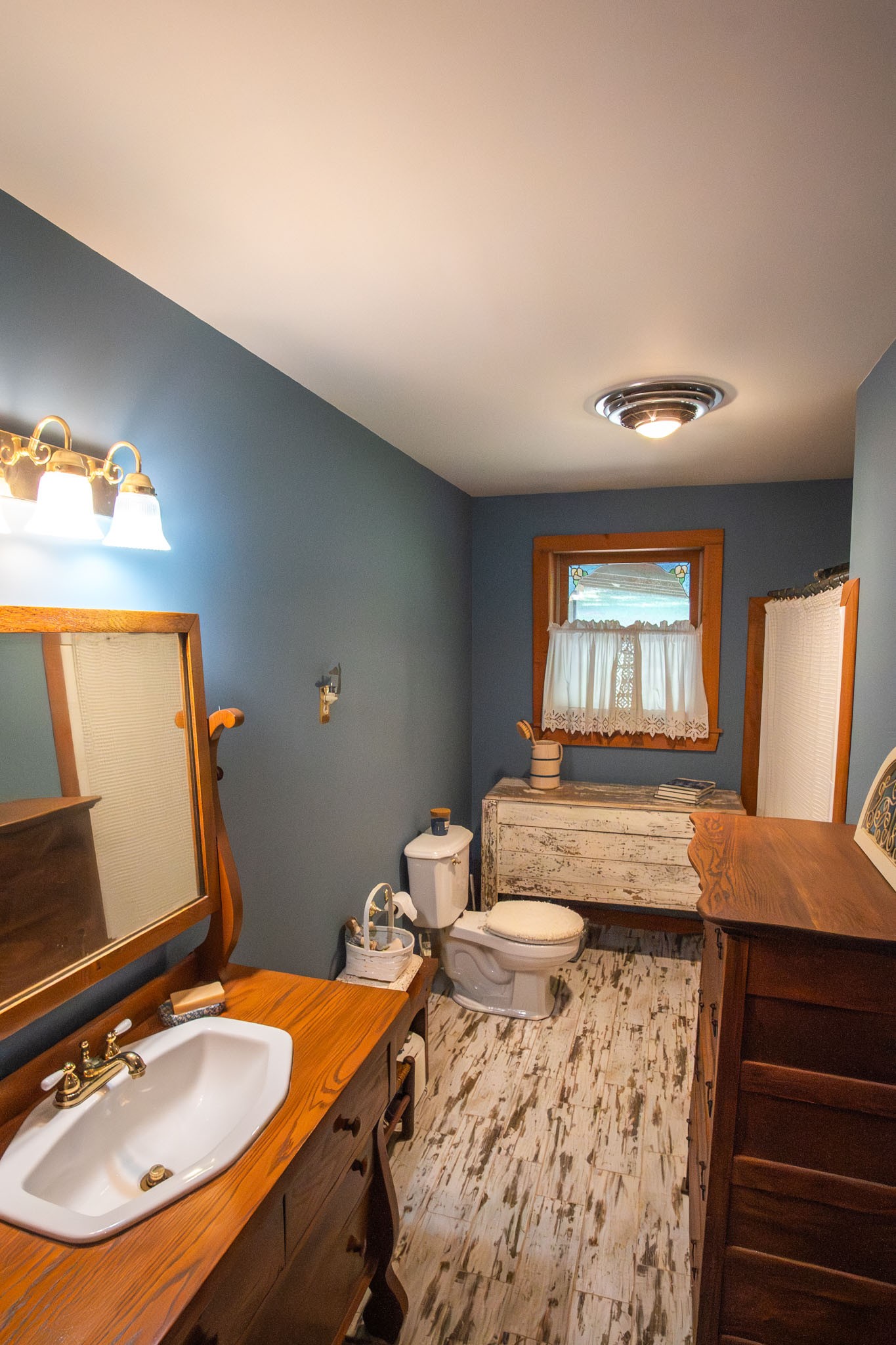 6861 Arno-Allisona Road College Grove, TN 37046 - Photo 33 of 68 a bathroom with a sink a bathtub a mirror and a window