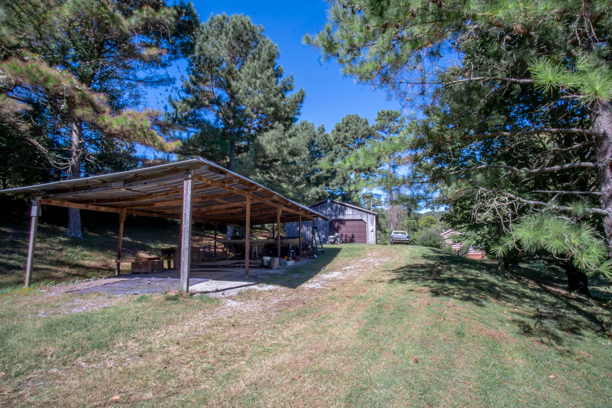 6861 Arno-Allisona Road College Grove, TN 37046 - Photo 50 of 68 a view of a house with a tree and wooden fence