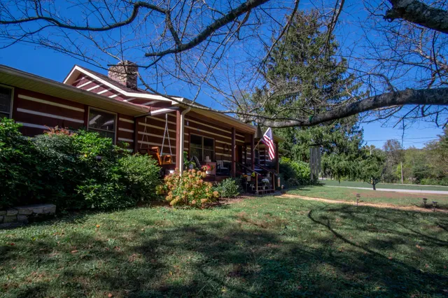 a room with furniture gym equipment and a chandelier