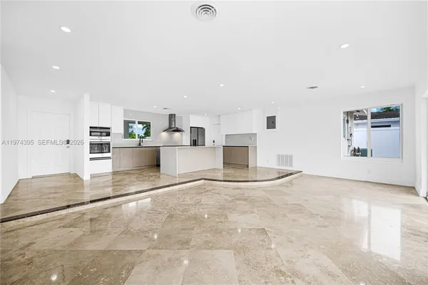 a view of kitchen with a sink and microwave