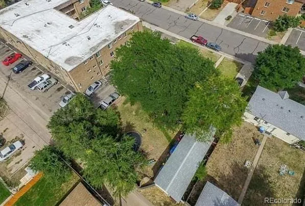 an aerial view of a house with a yard and garden