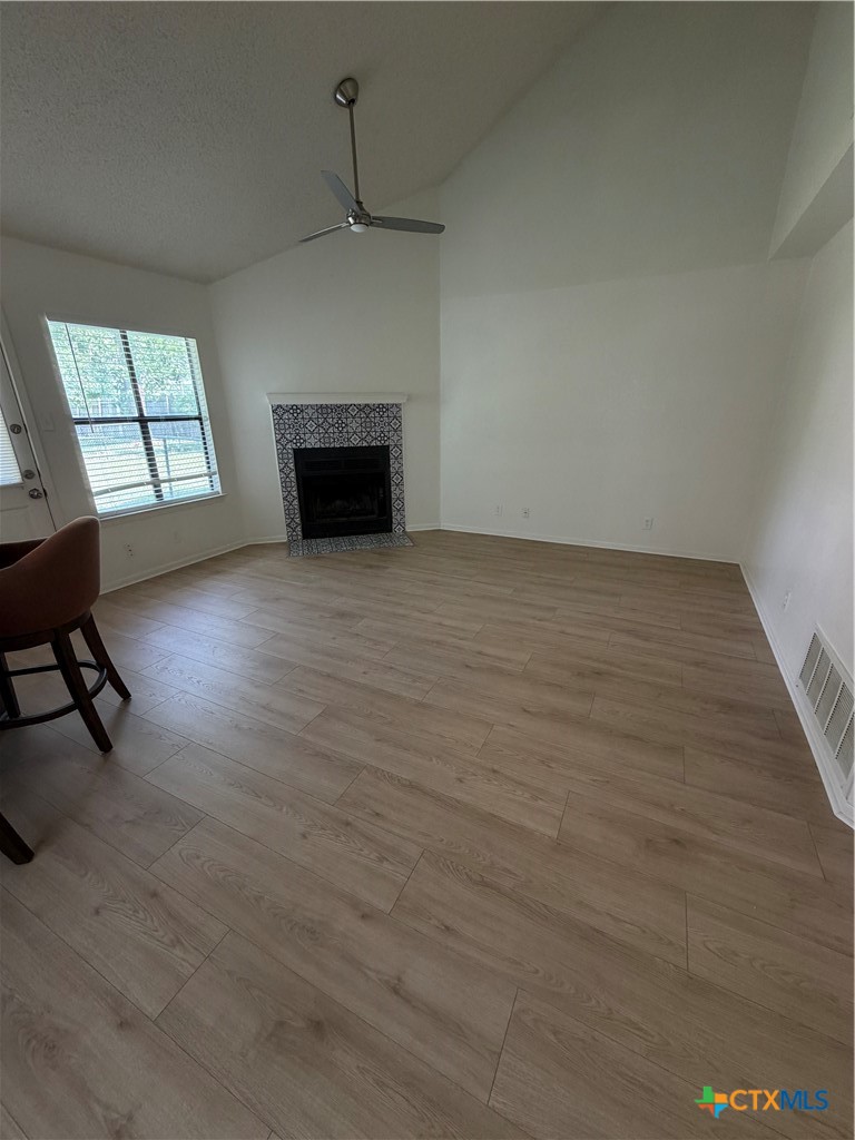 1316 Opal Road, Unit A Killeen, TX 76543 - Photo 6 of 25 a view of empty room with wooden floor and fireplace