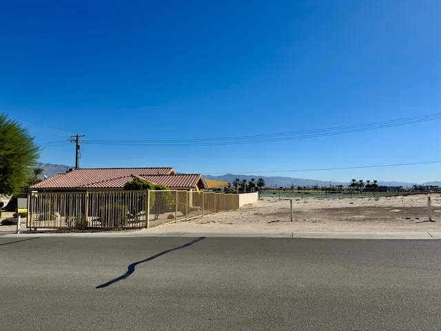 a view of a city street with tall buildings