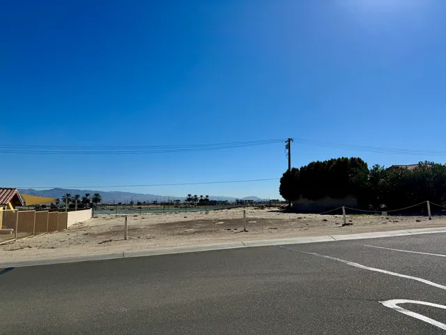 a view of a street with an ocean view