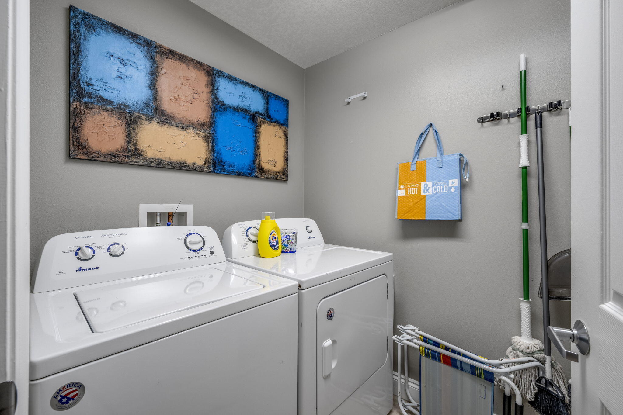 15817 Front Beach Road, Unit 21409 Panama City Beach, FL 32413 - Photo 15 of 23 a utility room with dryer and washer