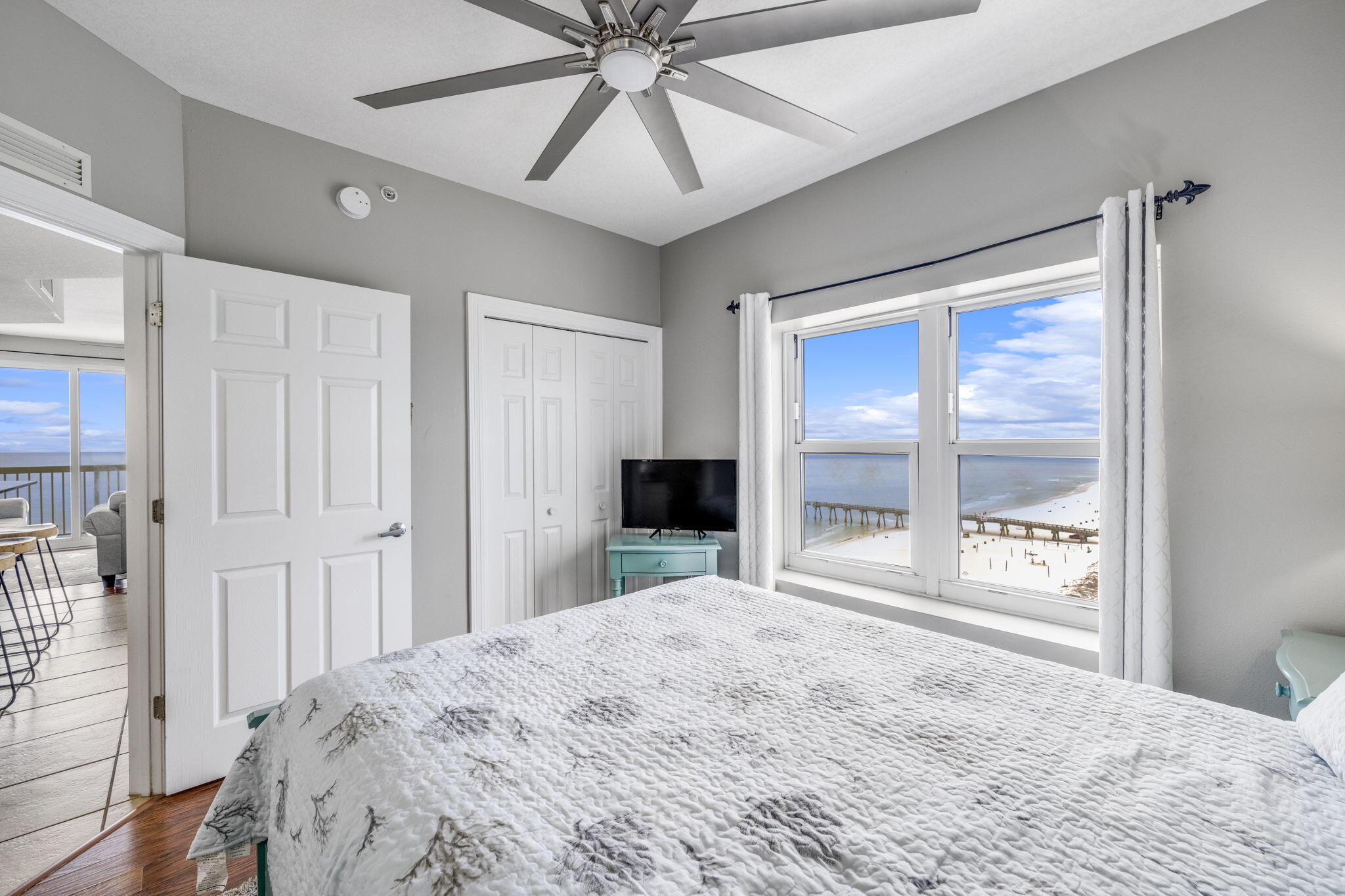 15817 Front Beach Road, Unit 21409 Panama City Beach, FL 32413 - Photo 9 of 23 a bedroom with a bed and a large window with the outer view