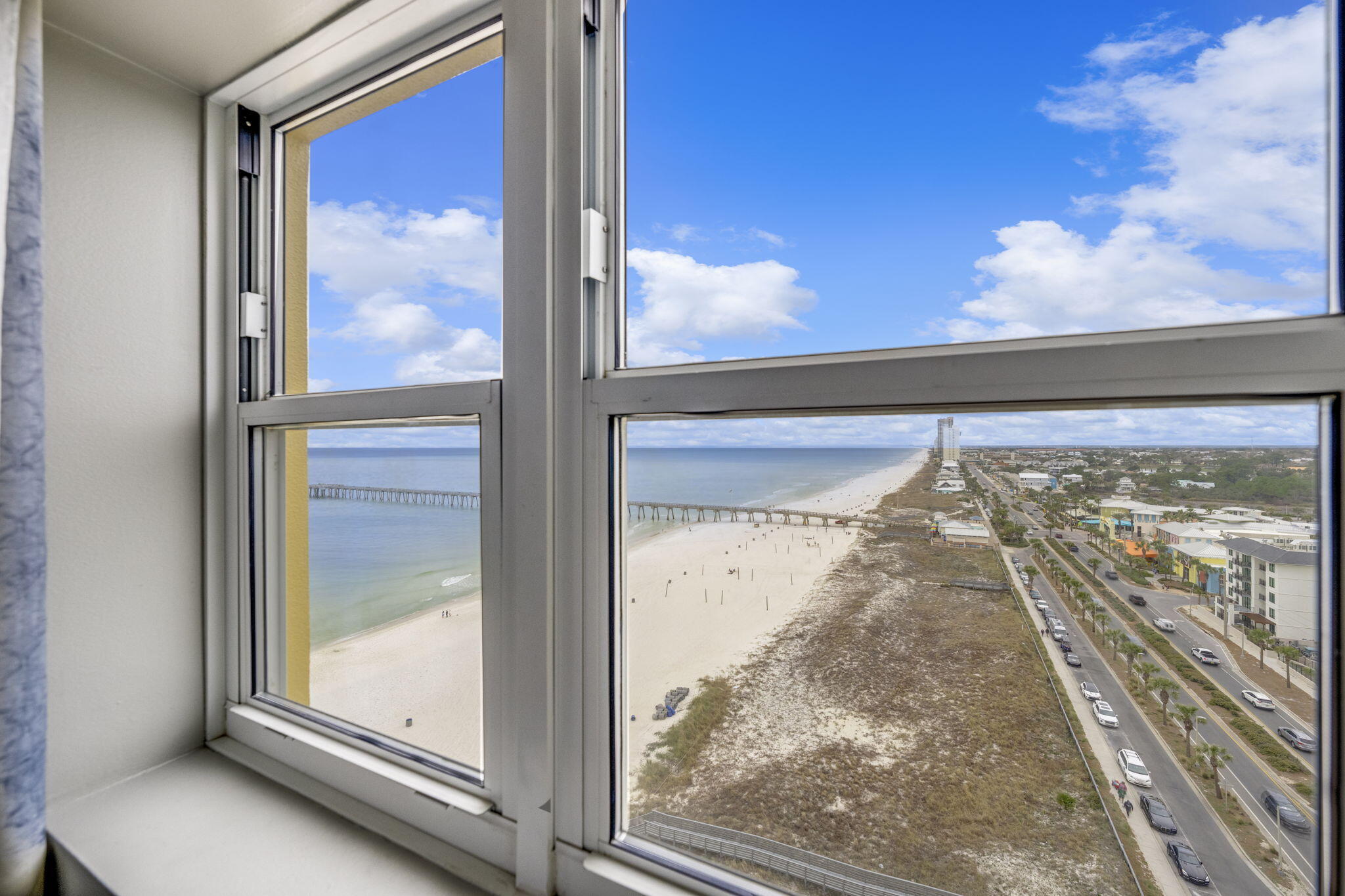 15817 Front Beach Road, Unit 21409 Panama City Beach, FL 32413 - Photo 10 of 23 a view of a glass door with a tree