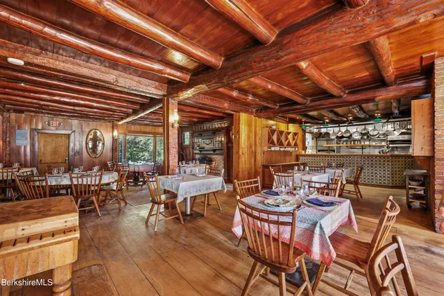 a view of a dinning table and chairs in the patio