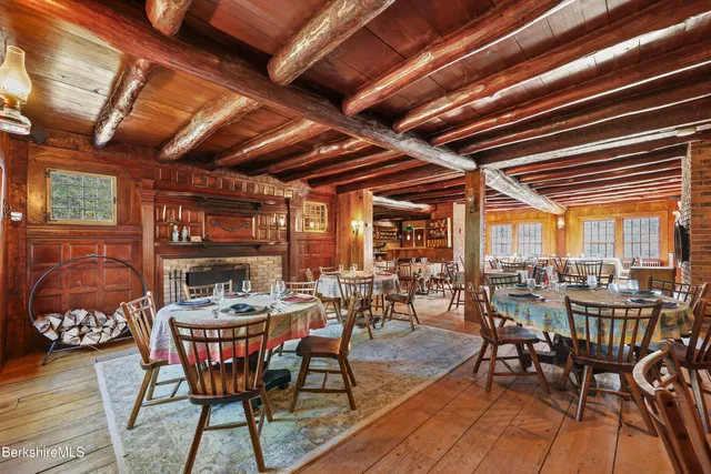 a outdoor dining space with furniture and wooden floor