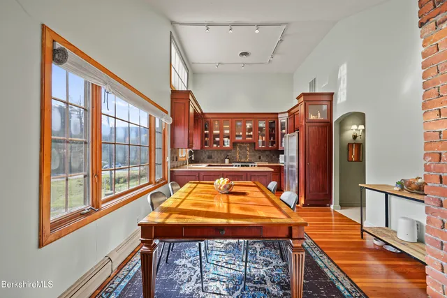 a dining room with a table and chairs in it
