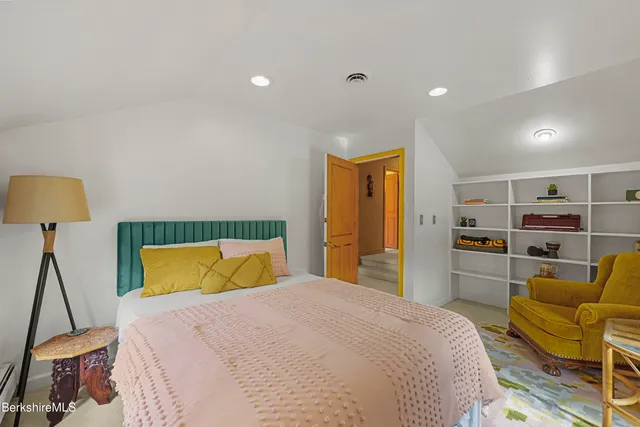 a bedroom with bed and a window