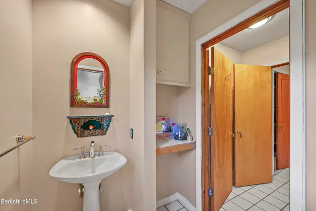 a bathroom with a shower and a glass door