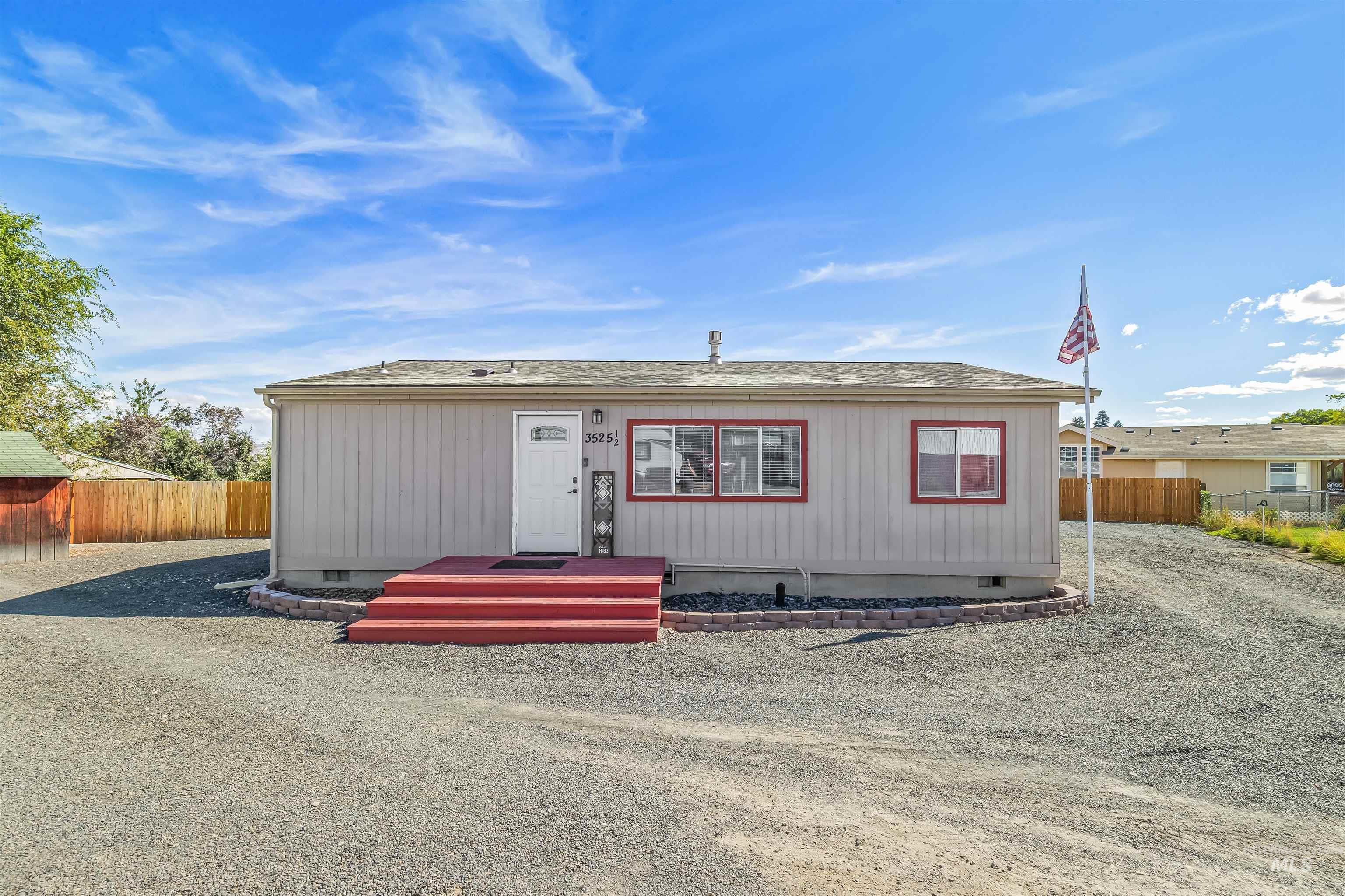 View of front of house featuring crawl space and roof with shingles