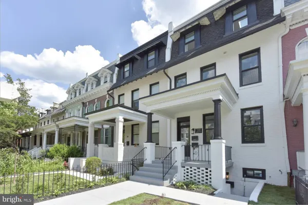 a front view of a building with garden