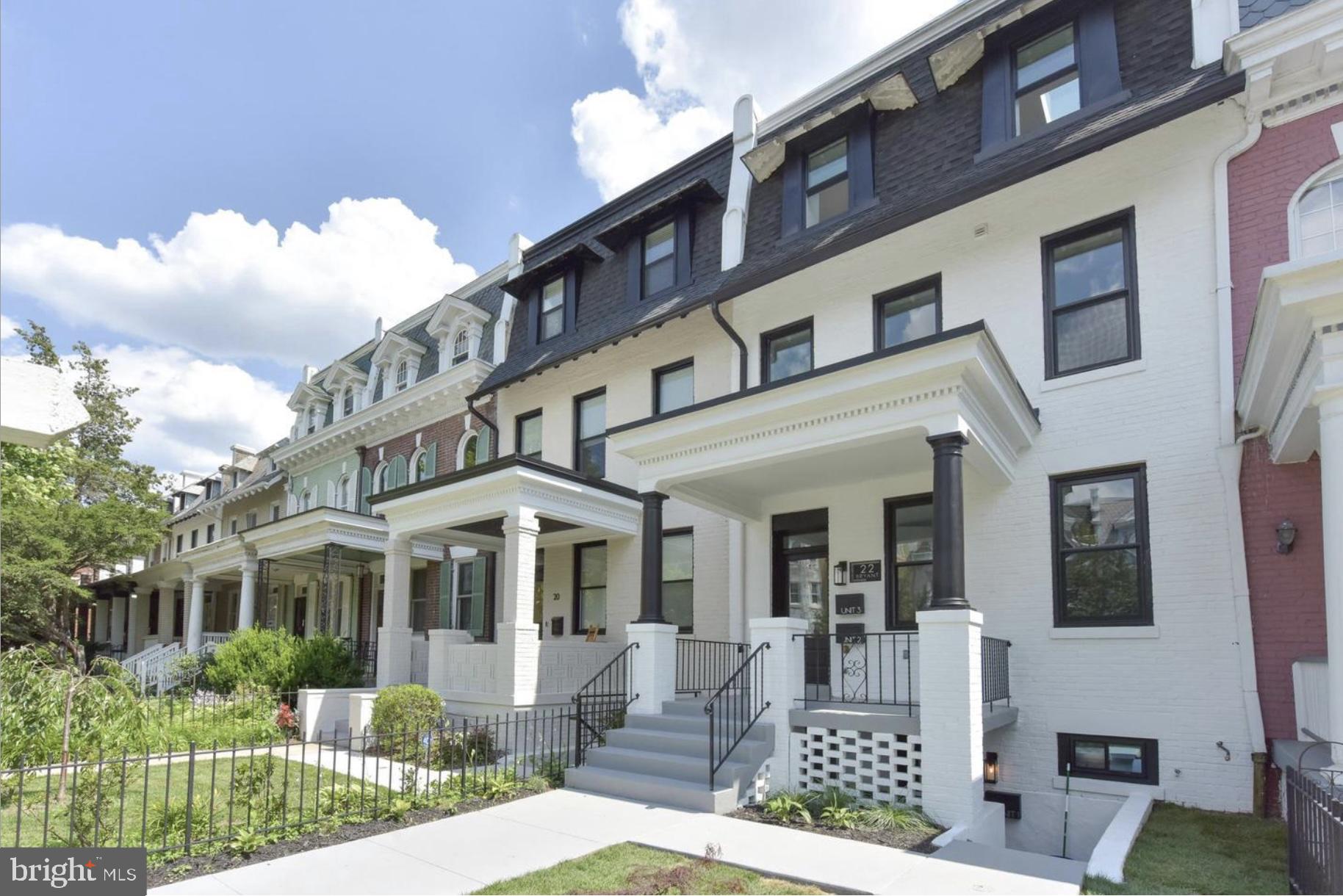 a front view of a building with garden