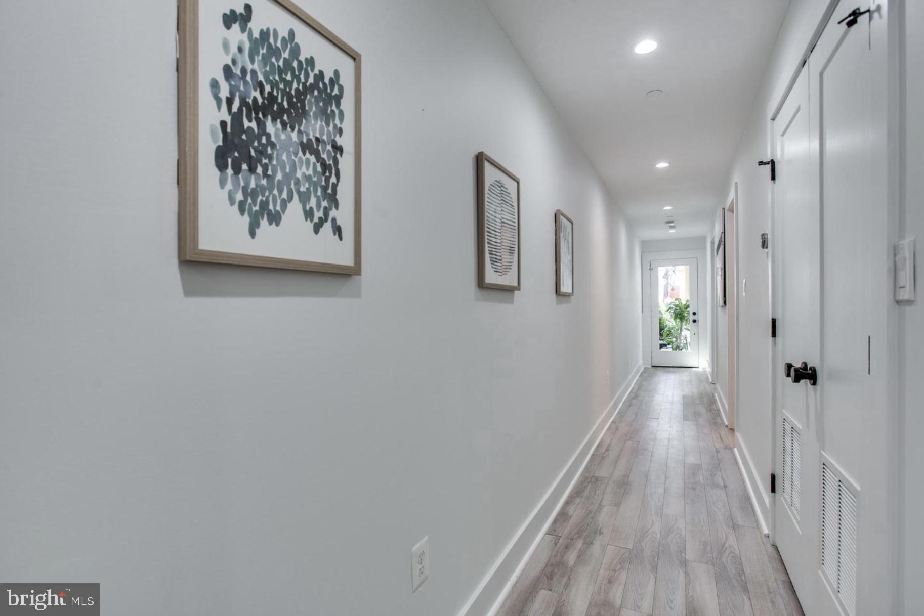 22 Bryant Street Northwest, Unit 1 Washington, DC 20001 - Photo 12 of 24 a view of a hallway with wooden floor