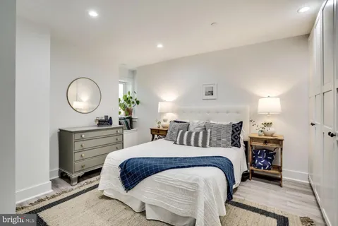 a bedroom with a bed and a dresser