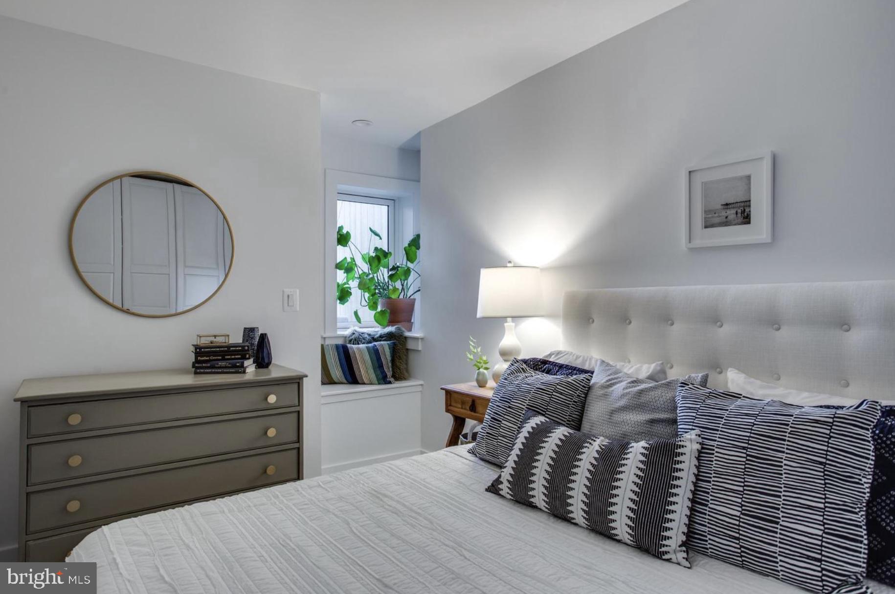 22 Bryant Street Northwest, Unit 1 Washington, DC 20001 - Photo 14 of 24 a bed room with a bed and a potted plant