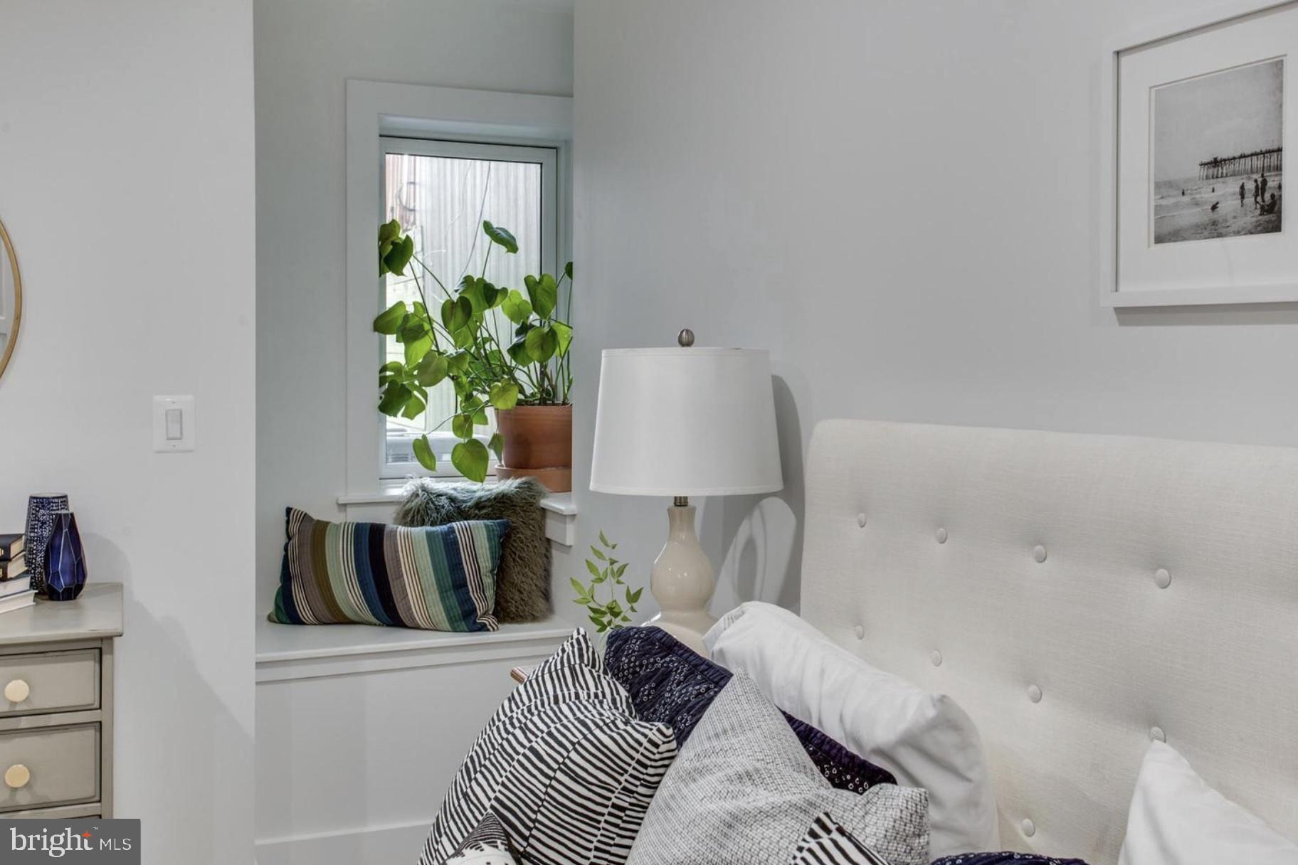 22 Bryant Street Northwest, Unit 1 Washington, DC 20001 - Photo 15 of 24 a bedroom with a bed and a potted plant