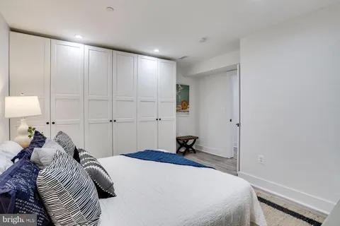 a bed room with a bed and a night stand