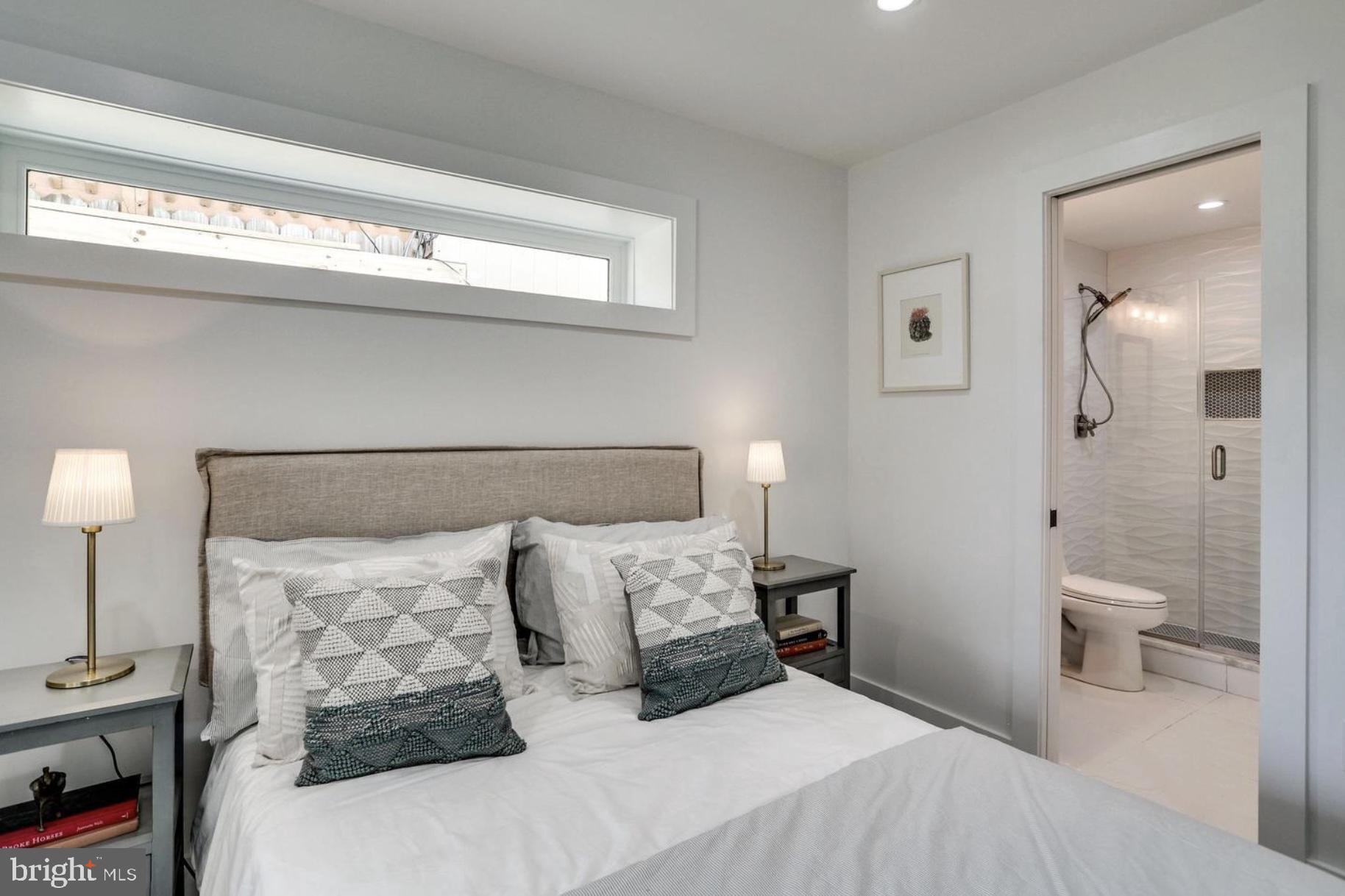 22 Bryant Street Northwest, Unit 1 Washington, DC 20001 - Photo 21 of 24 a bedroom with a bed and a night stand