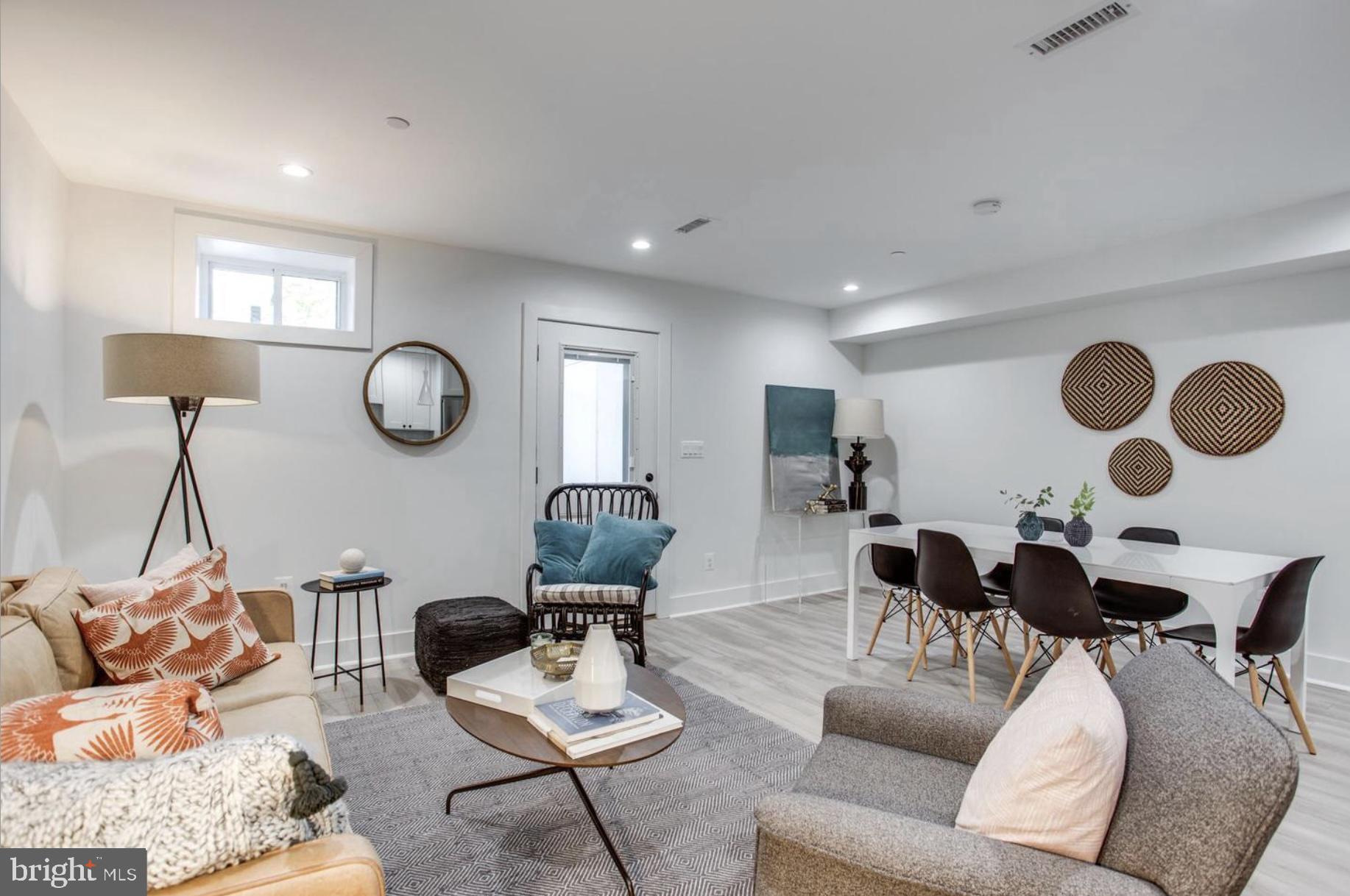 22 Bryant Street Northwest, Unit 1 Washington, DC 20001 - Photo 5 of 24 a living room with furniture and a mirror