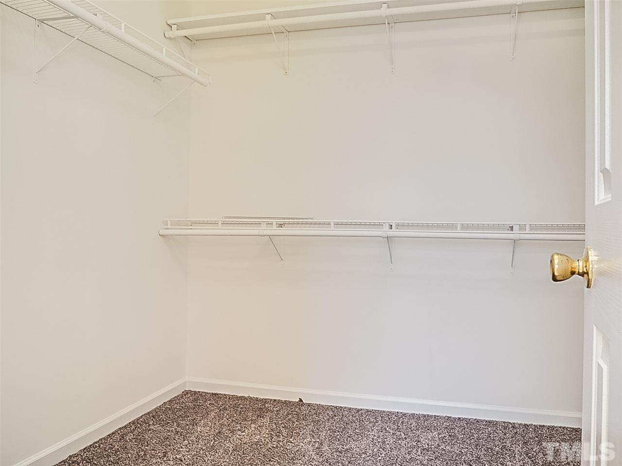 5705 Quitman Trail Raleigh, NC 27610 - Photo 11 of 20 a view of a room with racks on the wall