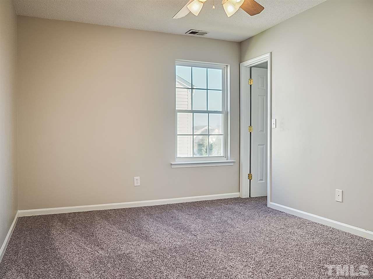 5705 Quitman Trail Raleigh, NC 27610 - Photo 13 of 20 an empty room with windows and closet