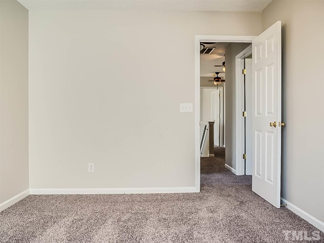 5705 Quitman Trail Raleigh, NC 27610 - Photo 14 of 20 an empty room with a hallway