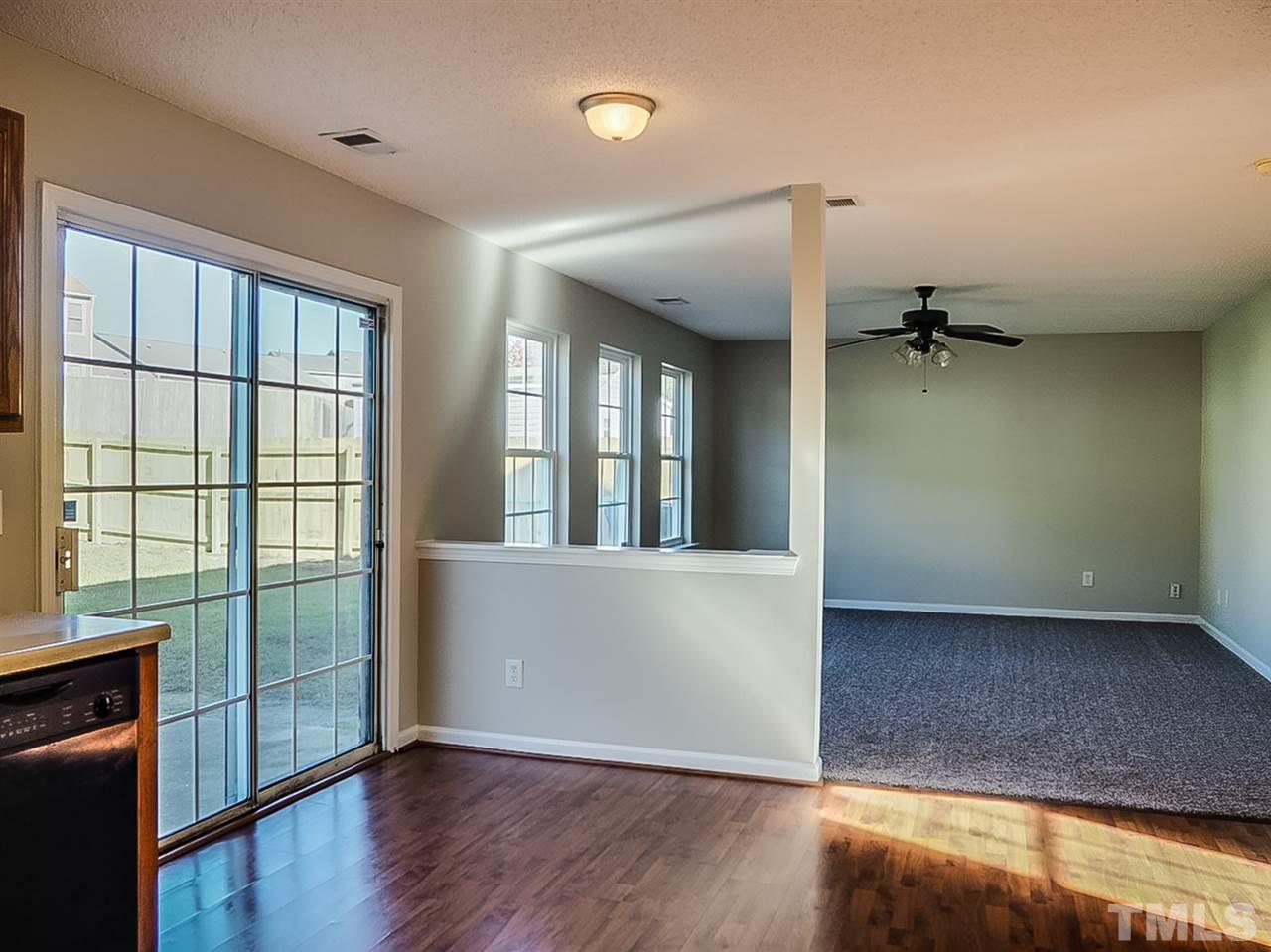 5705 Quitman Trail Raleigh, NC 27610 - Photo 3 of 20 wooden floor in an empty room with a window