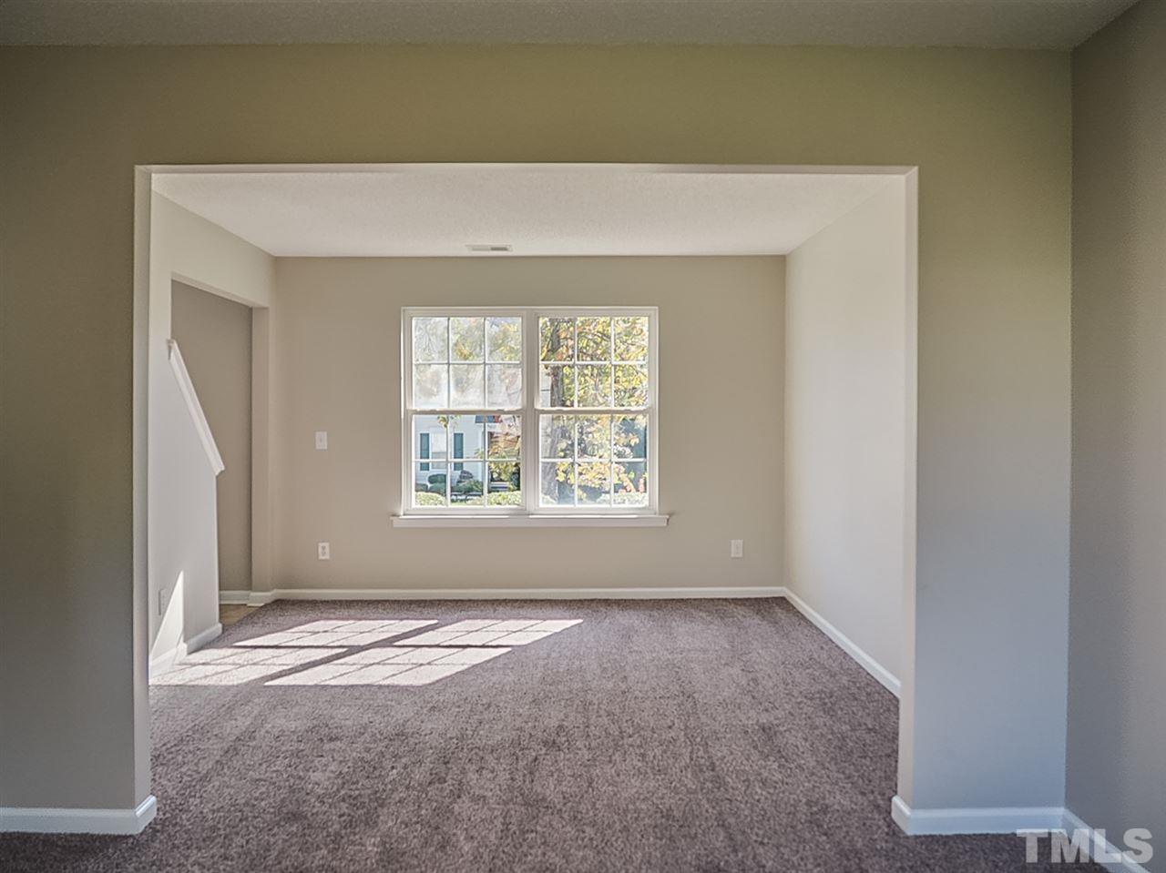 5705 Quitman Trail Raleigh, NC 27610 - Photo 6 of 20 an empty room with windows