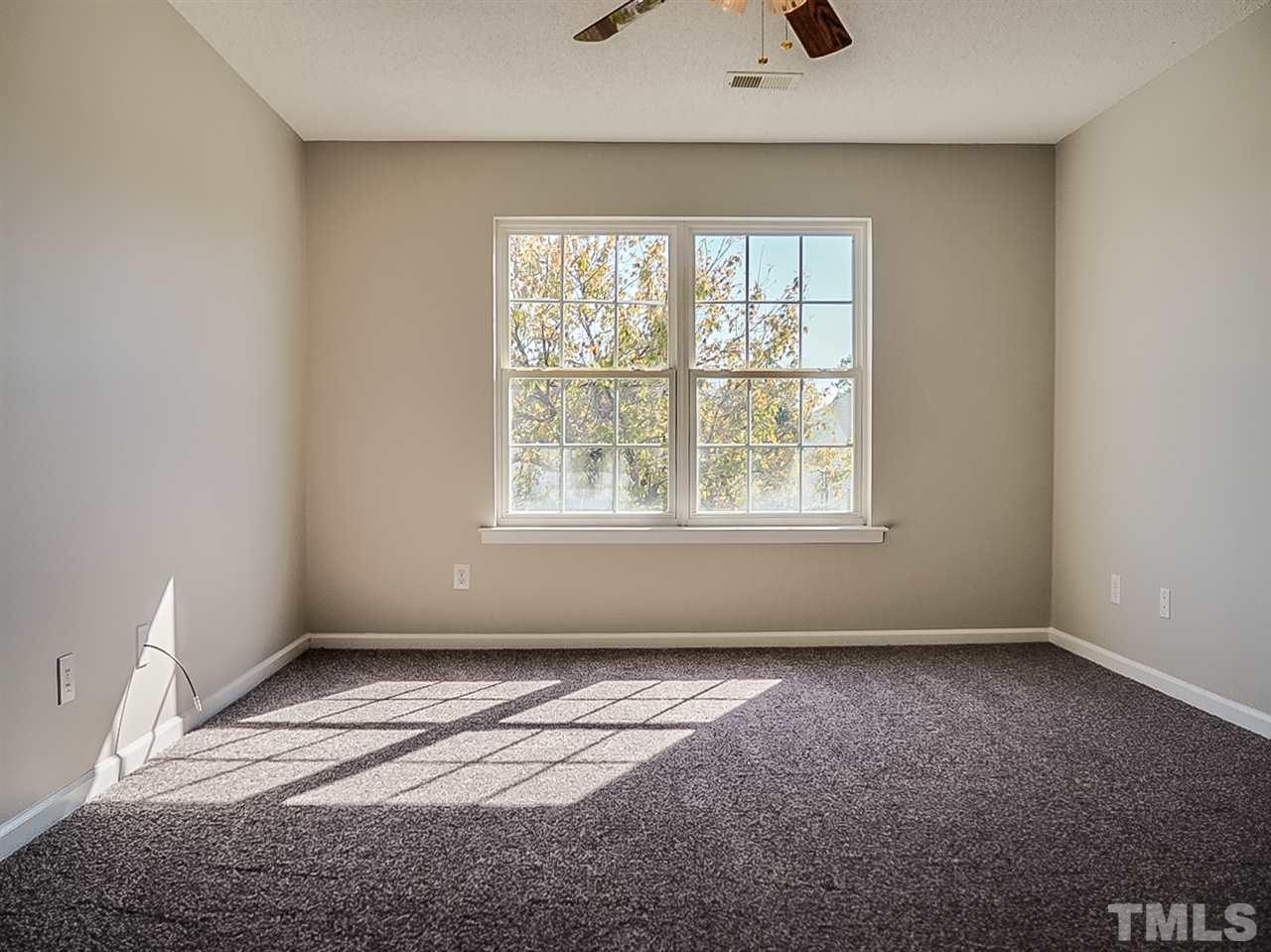 5705 Quitman Trail Raleigh, NC 27610 - Photo 9 of 20 an empty room with windows