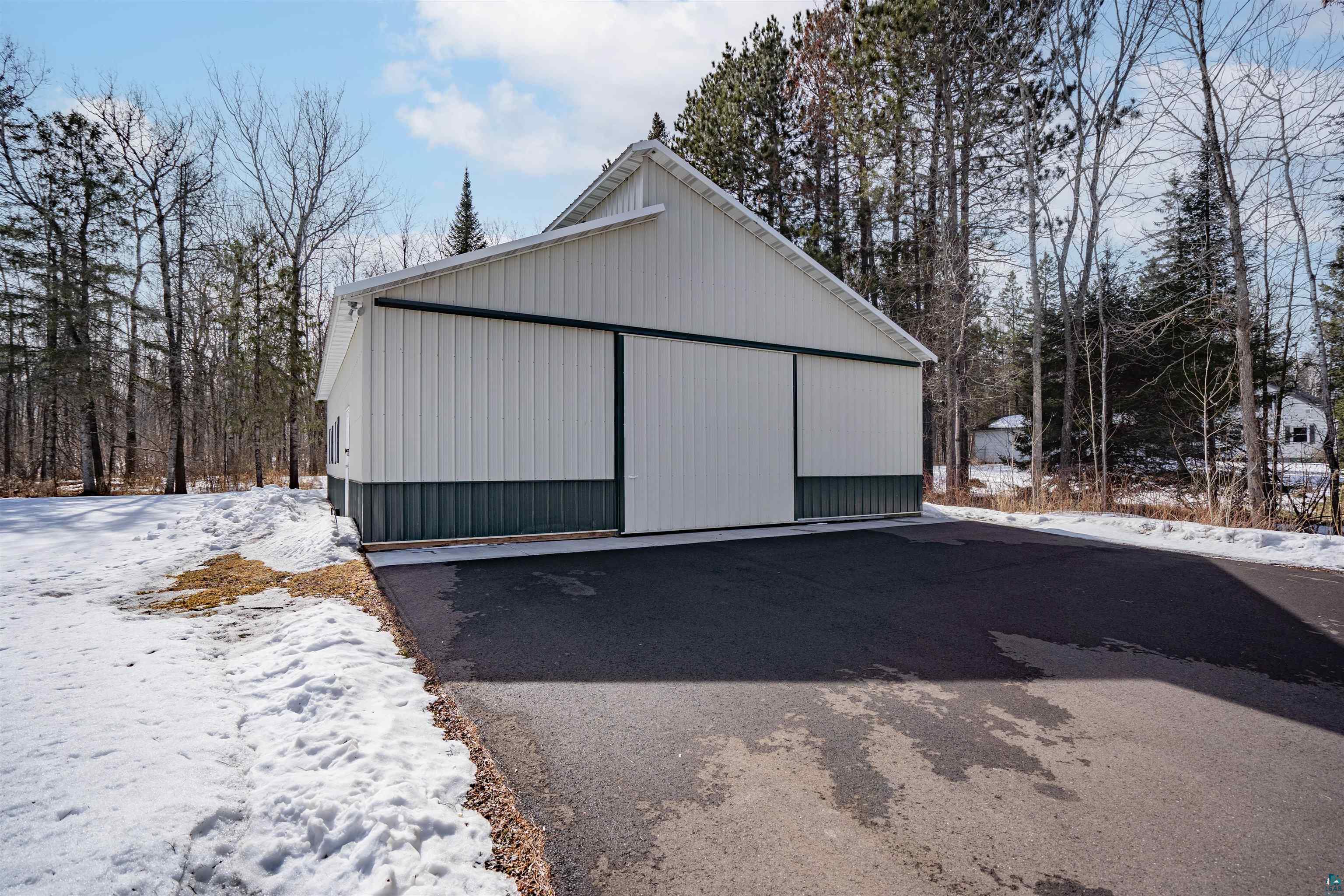 26 Riverside Road Esko, MN 55733 - Photo 29 of 34 Snow covered garage with a garage