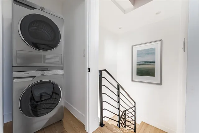 a view of a hallway with washer and dryer
