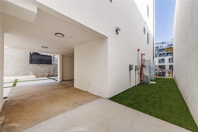 a view of a livingroom with furniture and an empty room