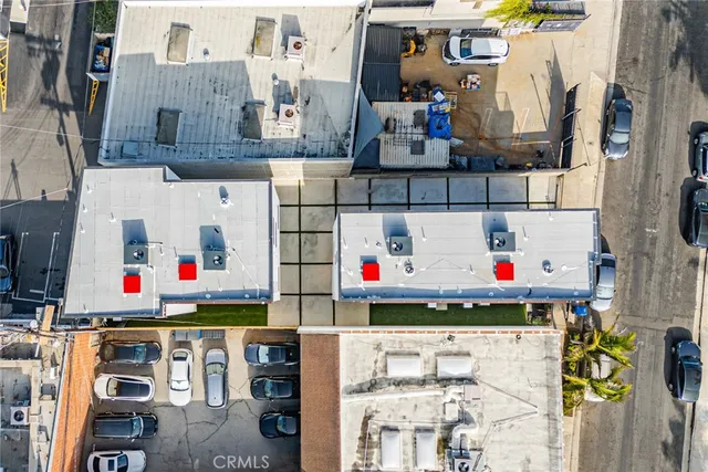 a utility room with stainless steel appliances and white cabinets