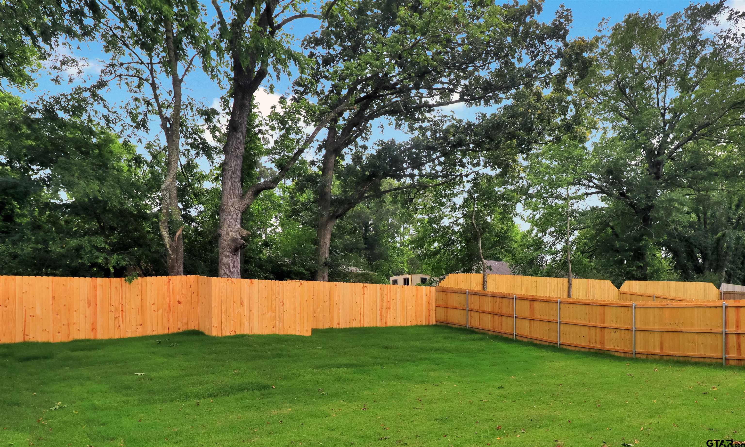 3057 Guinn Farms Road Tyler, TX 75707 - Photo 28 of 32 a view of yard with grass and trees