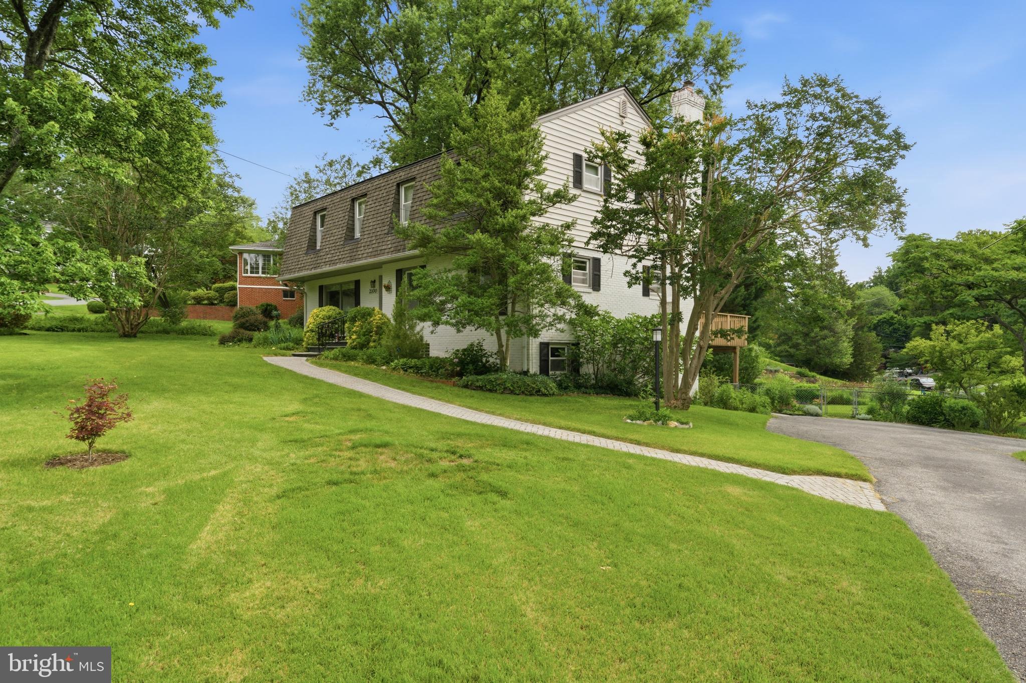 2100 Edgewater Parkway Silver Spring, MD 20903 - Photo 3 of 46 a view of a big house with a big yard and large trees