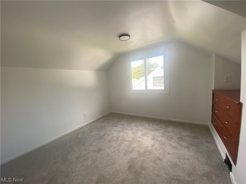 12913 Silver Road Cleveland, OH 44125 - Photo 14 of 23 2nd floor bedroom with light carpet and lofted ceiling