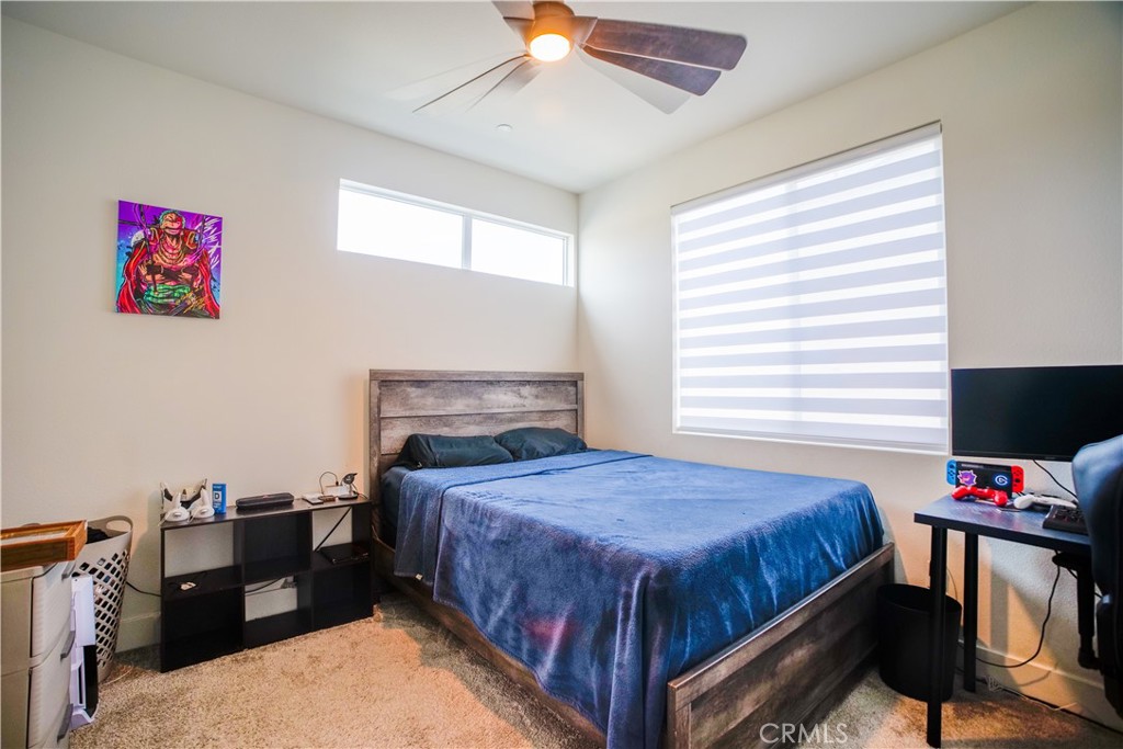 35323 Orchard Trail Fallbrook, CA 92028 - Photo 17 of 30 a bedroom with a bed and a tv