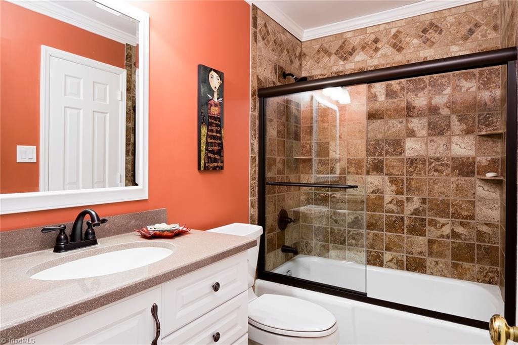 4912 Hackamore Road Greensboro, NC 27410 - Photo 17 of 30 Main Level Guest Bathroom with Solid Surface Countertop