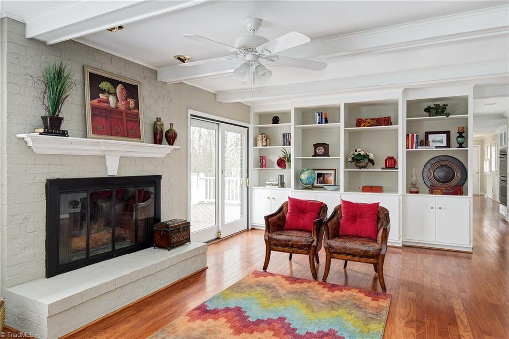 4912 Hackamore Road Greensboro, NC 27410 - Photo 6 of 30 Main Level Den with Gas Log Fireplace and Built-Ins