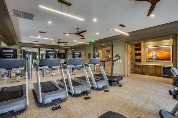 a view of a house with fountain in front of it