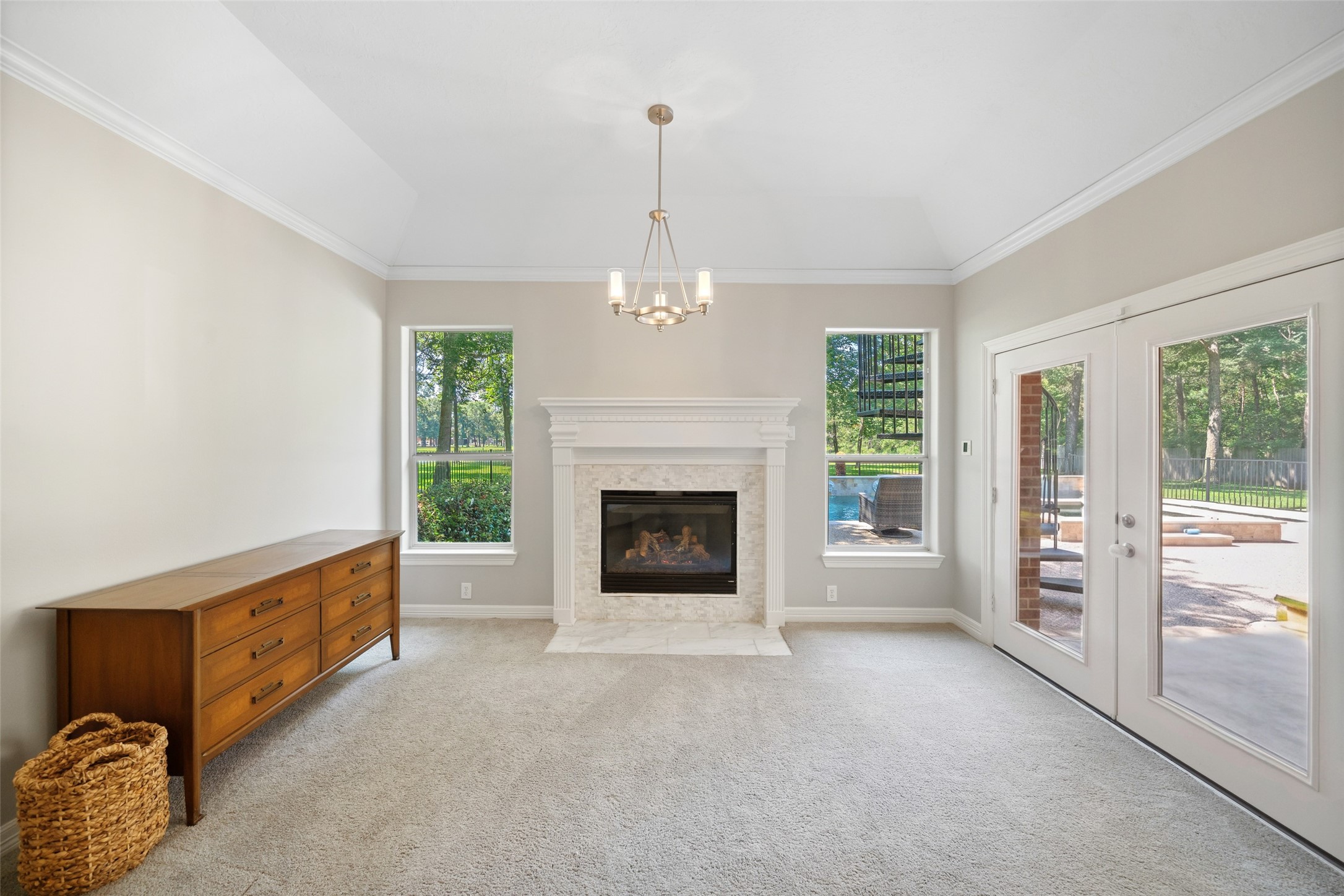 2302 Legends Shore Drive Spring, TX 77386 - Photo 29 of 49 Cozy fireplace creates a warm focal point in the primary suite.