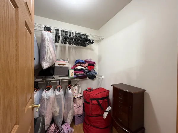 a bedroom with a bed and a closet