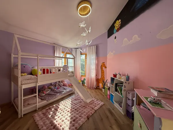 a bed room with a bed and a chair