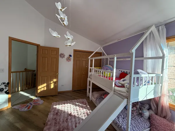 a bedroom with furniture and a window
