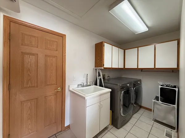 a view of a hallway with entryway door